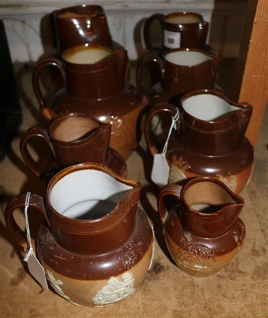 8 graduated Royal Doulton stoneware jugs